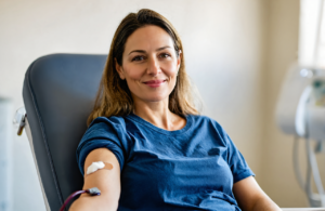 Woman with an adhesive bandage on her inner elbow after a blood draw in Vancleave, MS