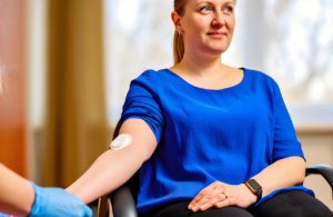 Woman resting her arm after walk-in blood work and lab testing near Gulfport, MS
