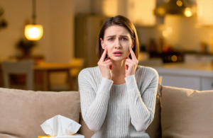 Woman at home with sinus pressure and congestion, sinus infection treatment in Vancleave MS